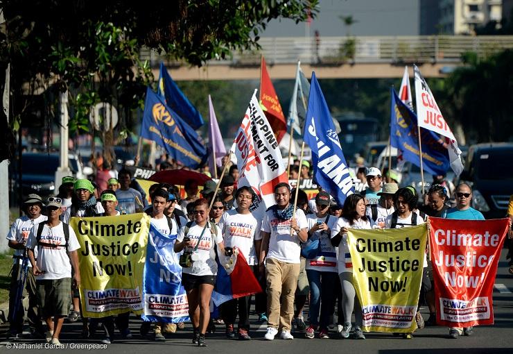 Climate change activists rally against carbon producers. (Photo courtesy of Green Peace South East A